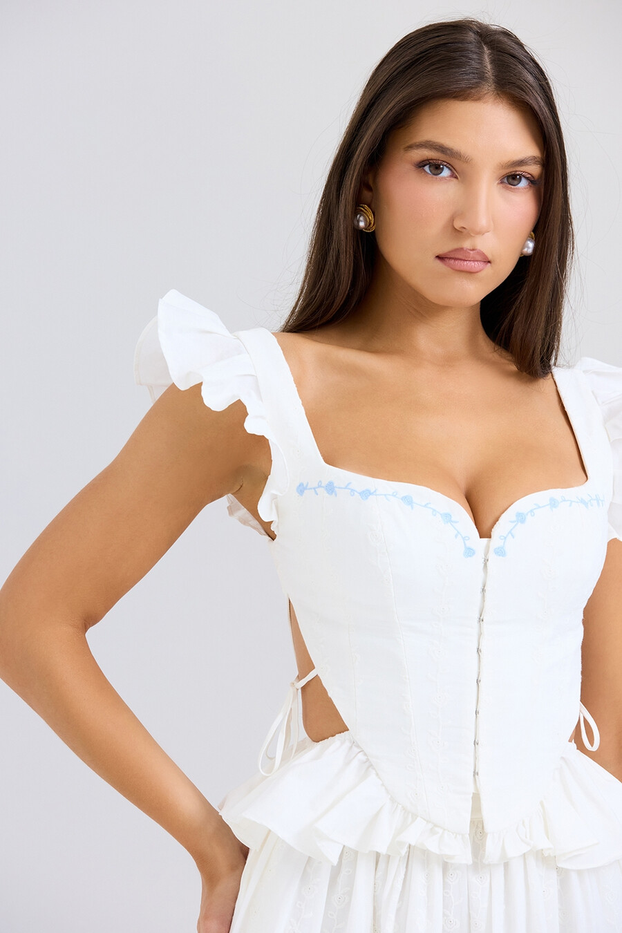 weißes besticktes baumwoll-peplum-korsett-top